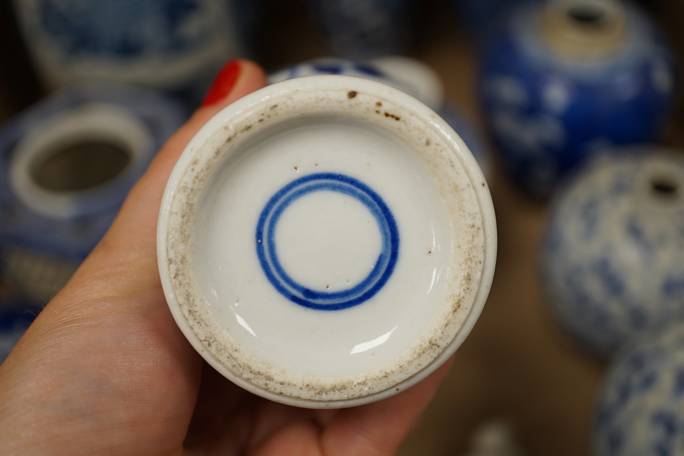A collection of 18th - early 20th century Chinese blue and white porcelain vases, jars and spare covers, together with some Japanese blue and white ceramics, tallest 21cm